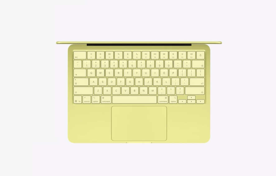 MacBook Neo лимонного кольору — вигляд зверху на клавіатуру та фізичний трекпад