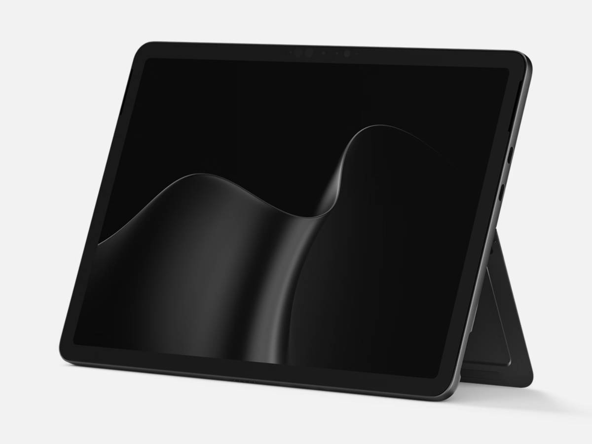 Surface Laptop 13 у чорному кольорі в режимі планшета з хвилеподібним зображенням на дисплеї