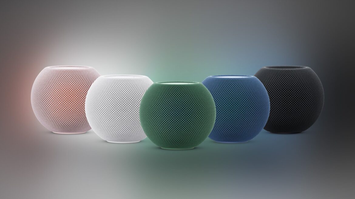 П'ять HomePod mini у різних кольорах - рожевому, білому, зеленому, синьому та чорному - розташовані поряд на світлому фоні