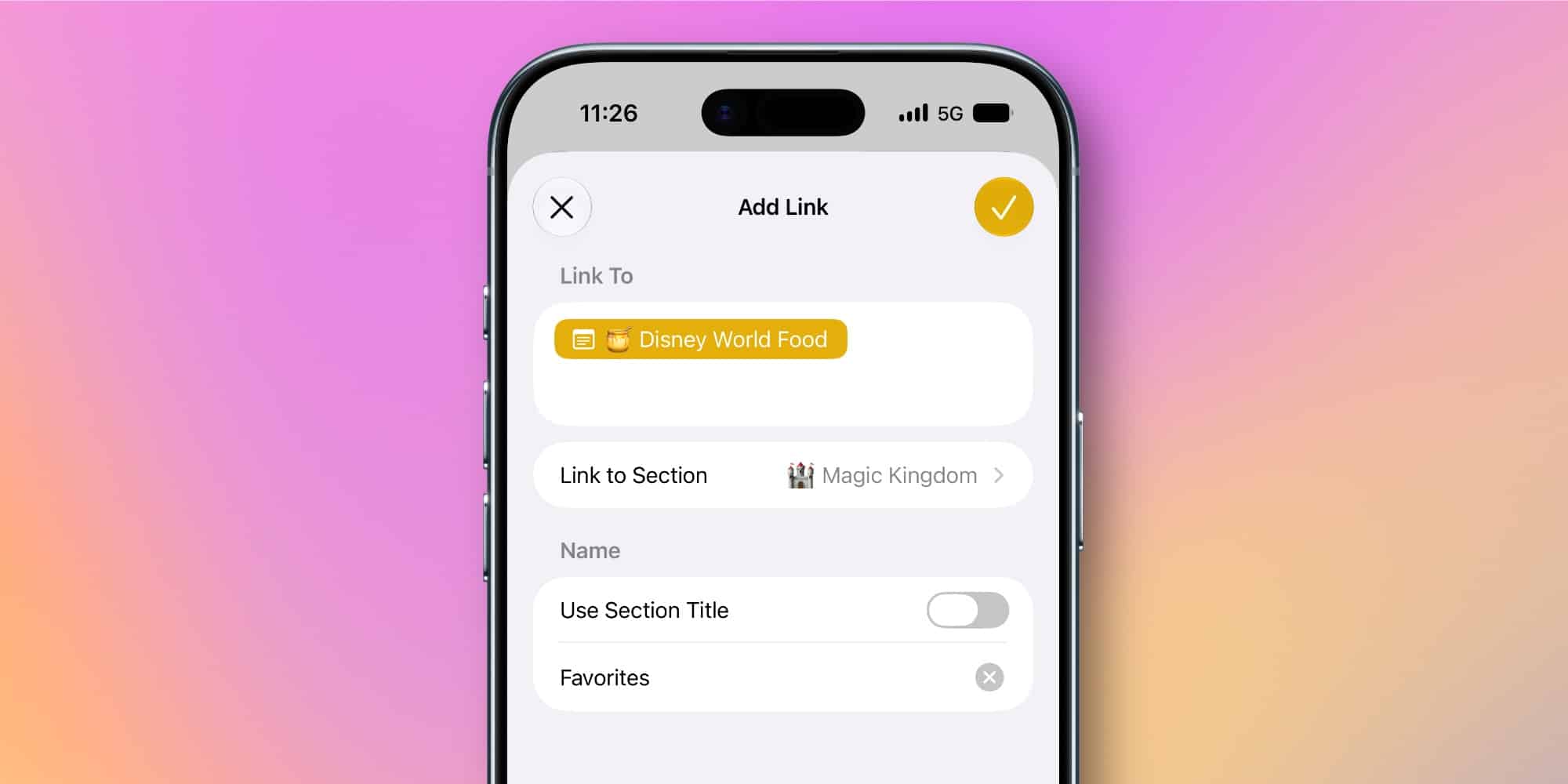 Екрана iPhone з діалоговим вікном додавання посилання в Apple Notes, де показано опцію вибору розділу Magic Kingdom
