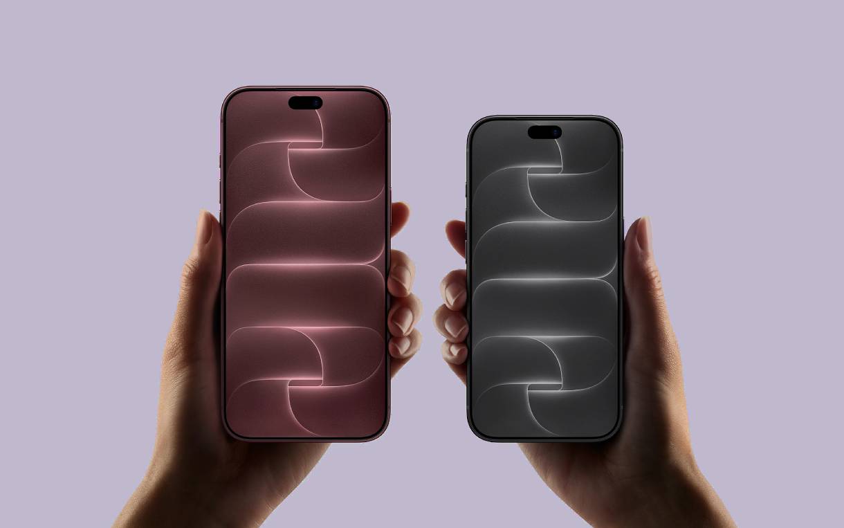 Дві моделі iPhone в руках, ліва бордова, права чорна, з однаковим дизайном екрану