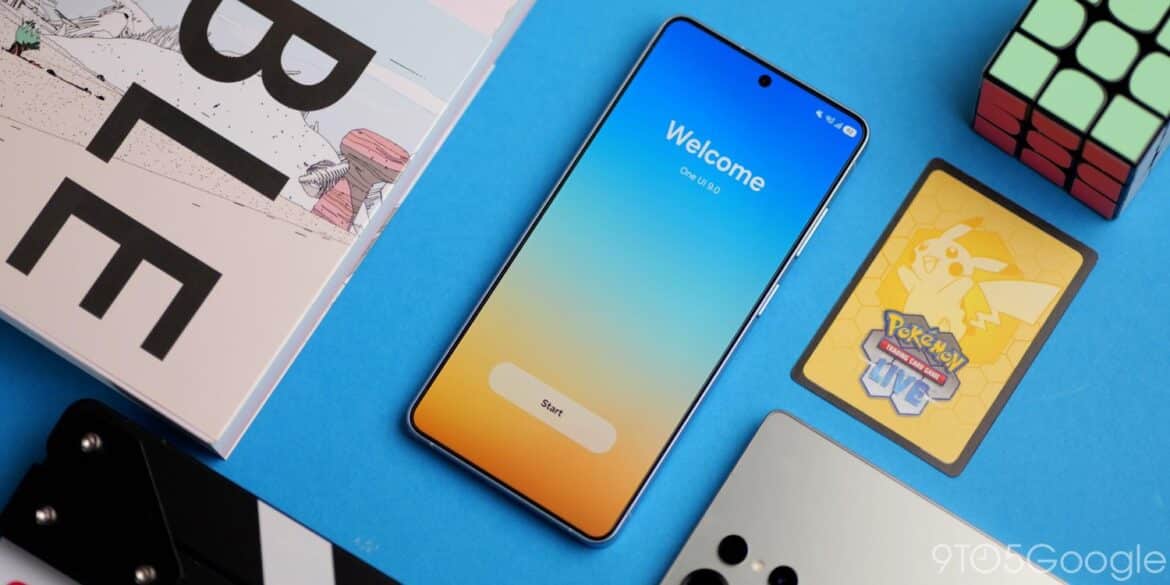 Смартфон Samsung Galaxy з екраном Welcome на блакитному тлі поруч із Rubik's Cube, картками Pokemon та журналом